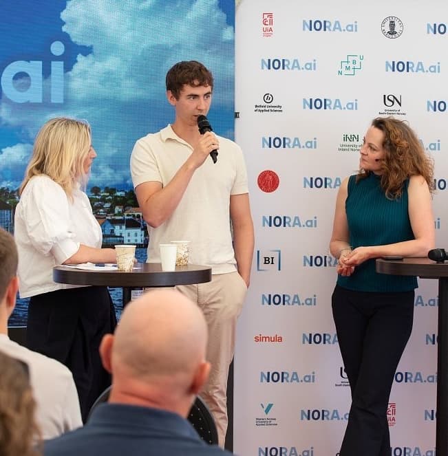 Oskar Solberg speaking on a panel at a NORA.ai conference