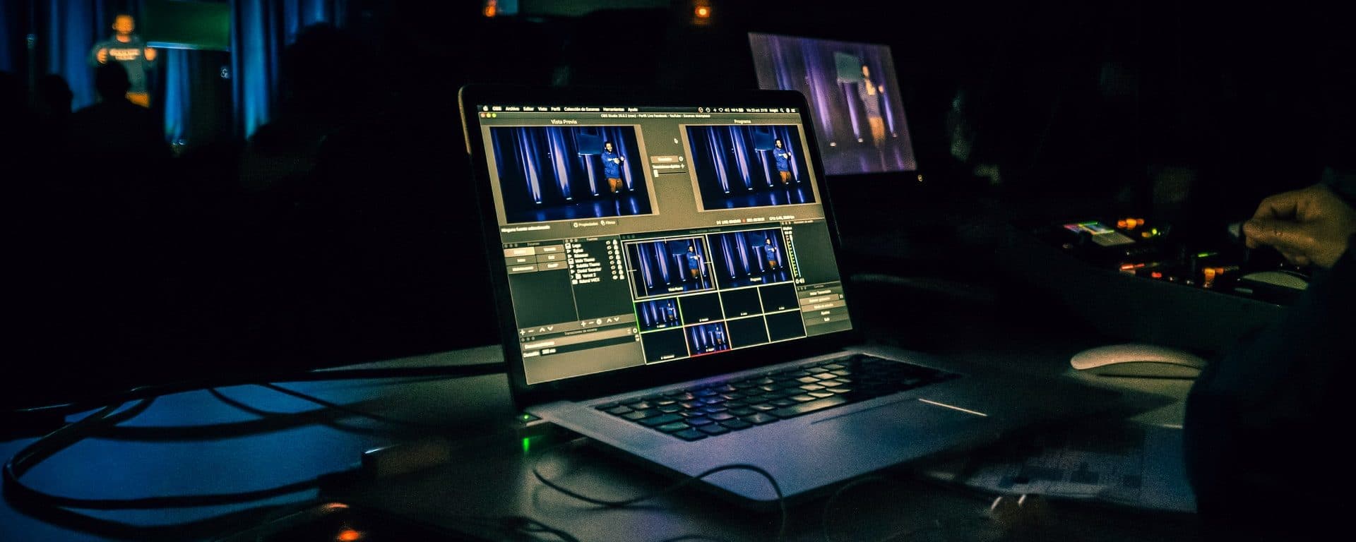 Laptop running a live video-production interface at an event