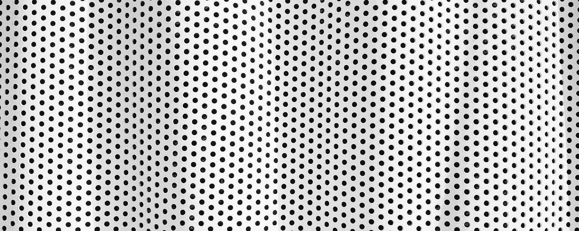 Pattern of perforated white metal panels