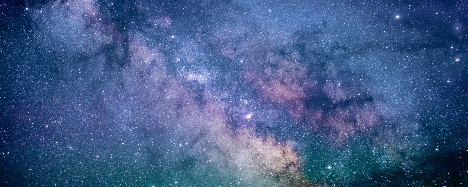 Milky Way and stars across a dark blue night sky